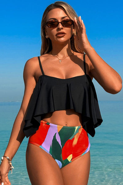 Two-piece swimsuit with large ruffled sleeves and floral shorts
