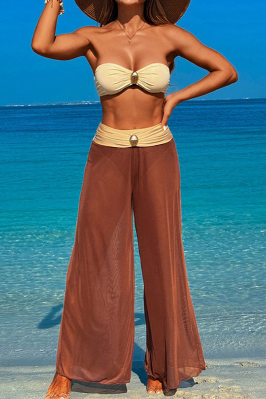 Three-piece swimsuit with button-like decorations on the chest