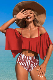 Two-piece swimsuit with large ruffled sleeves and floral shorts