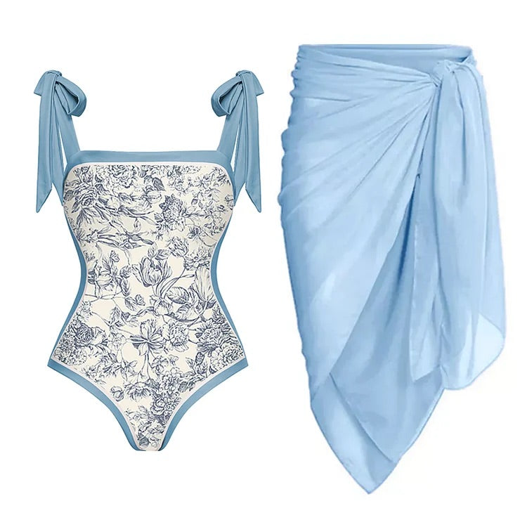 swimgirls Blauer, wendbarer Badeanzug mit Schleife und Schulterschnürung und Sarong/Rock 