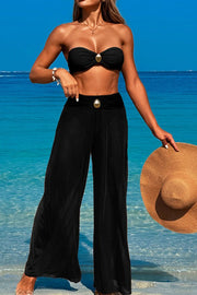 Three-piece swimsuit with button-like decorations on the chest