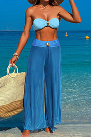 Three-piece swimsuit with button-like decorations on the chest