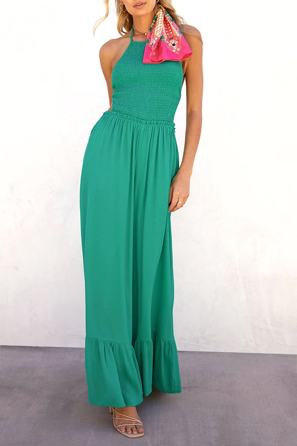 Solid color halter neck open back flared jumpsuit