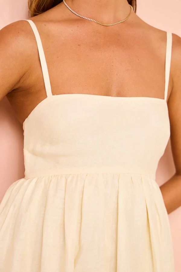 Robe longue ample à bretelles et poches, imprimé unique en mélange de lin et de fleurs paradisiaques