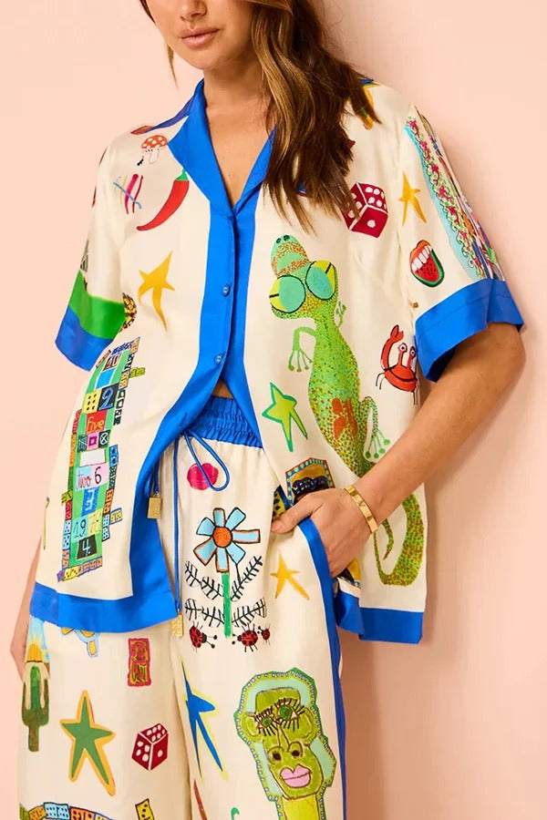 Lebendige Strand-Satin-Übergröße-Bluse mit einzigartigem Druck und Colorblock-Besatz