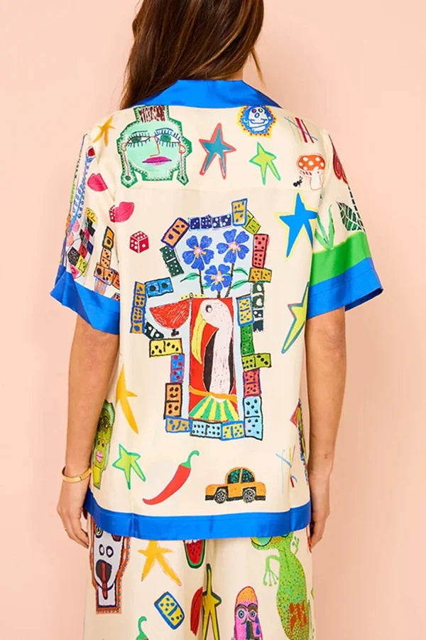 Lebendige Strand-Satin-Übergröße-Bluse mit einzigartigem Druck und Colorblock-Besatz