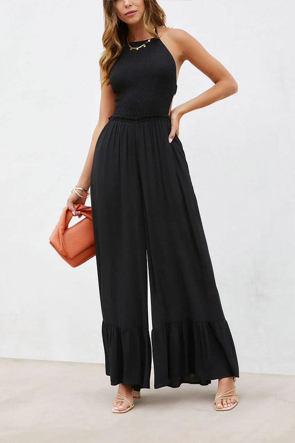 Solid color halter neck open back flared jumpsuit